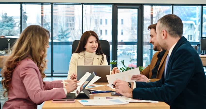 Business team discussing sales strategy in a modern office