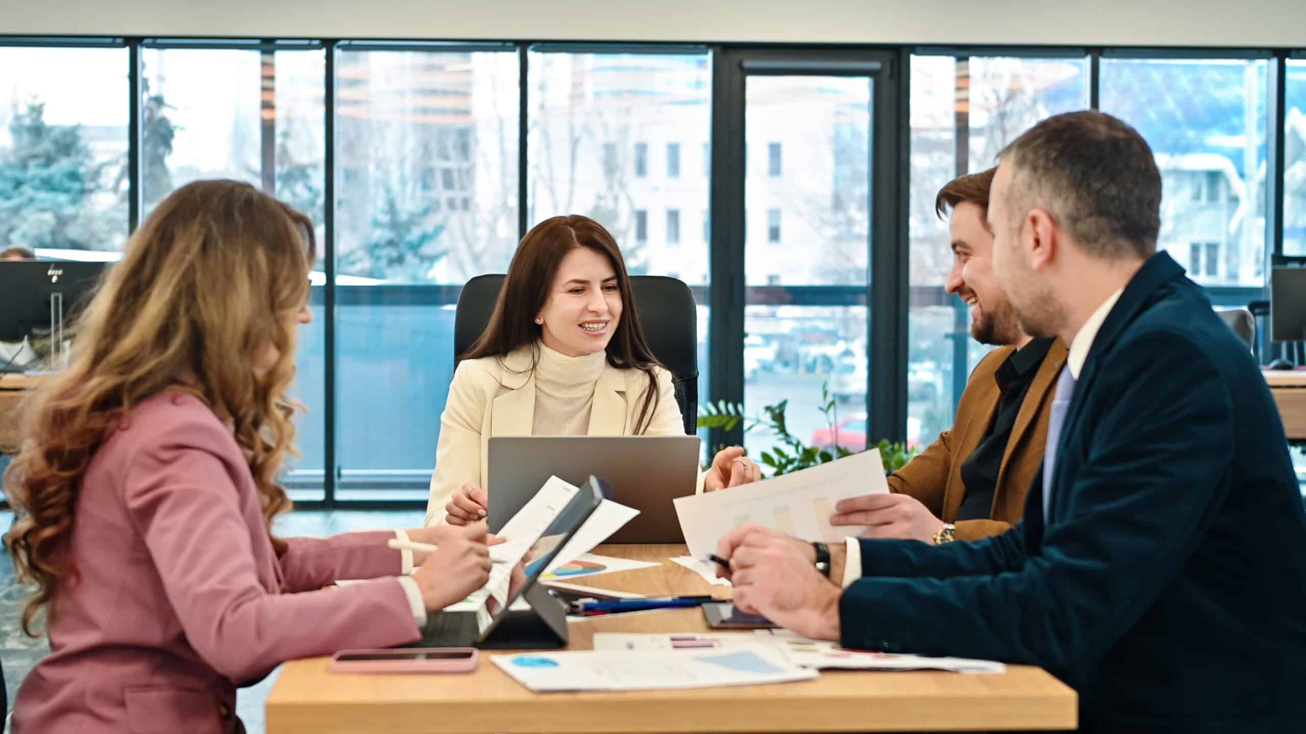 Business team discussing sales strategy in a modern office