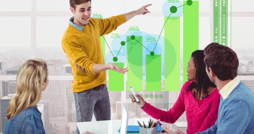 Sales team reviewing growth chart and performance metrics.