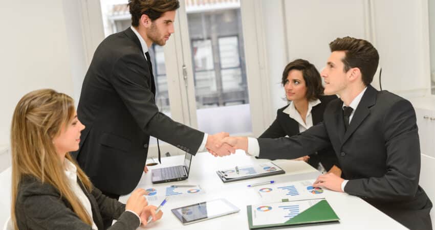 Business handshake during a professional meeting.