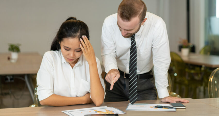 Business team discussing reports in a meeting room.