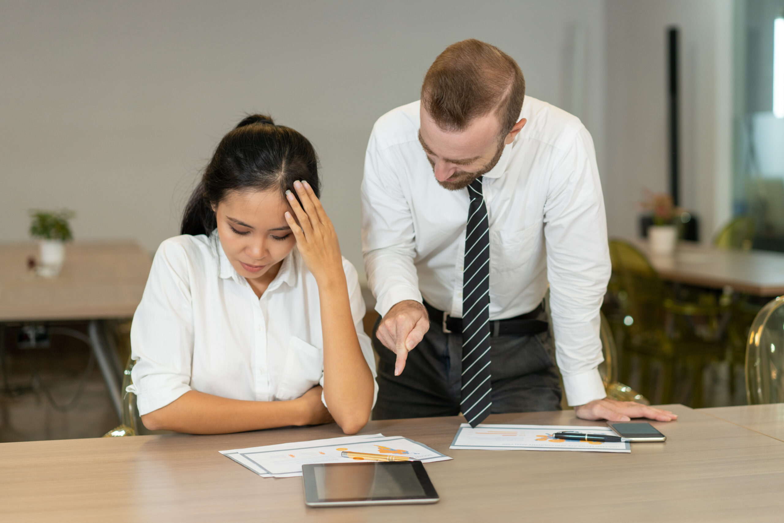 Business team discussing reports in a meeting room.